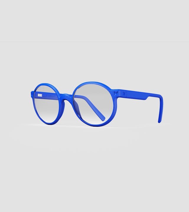 Round blue 3D-printed glasses with clear lenses are designed for an excellent fit across various nose profiles. Offering stylish and comfortable option for those seeking unique and customizable eyewear.