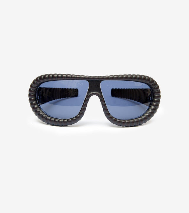 Fashion-forward gold ribbed sunglasses with brown lenses for a bold statement