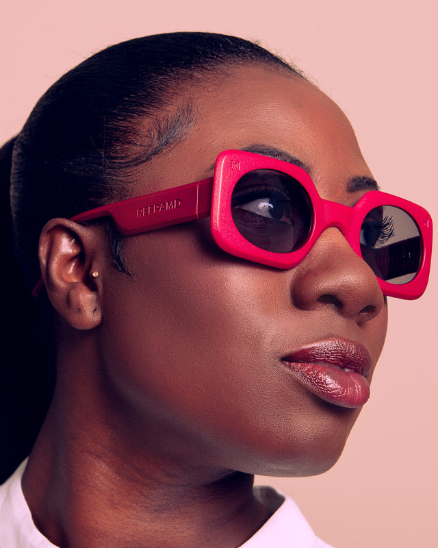 A stylish woman weraring 3D printed and trendsetting sunglasses in 2024