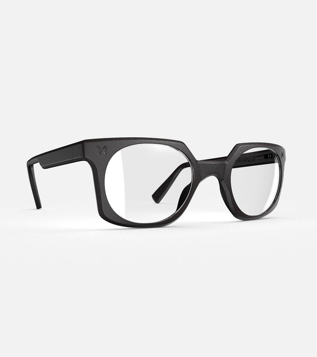 Black square-frame glasses with clear lenses, designed with an inclusive fit for all nose bridges, featuring a modern minimalist design