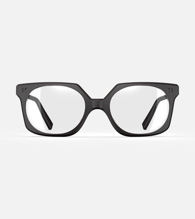 Black square-frame glasses with clear lenses, designed with an inclusive fit for all nose bridges, featuring a modern minimalist design
