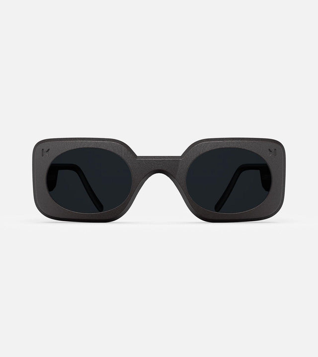 Stylish 3D printed black Planga sunglasses with a bold rectangular frame and dark lenses, designed for a comfortable fit across diverse nose bridges
