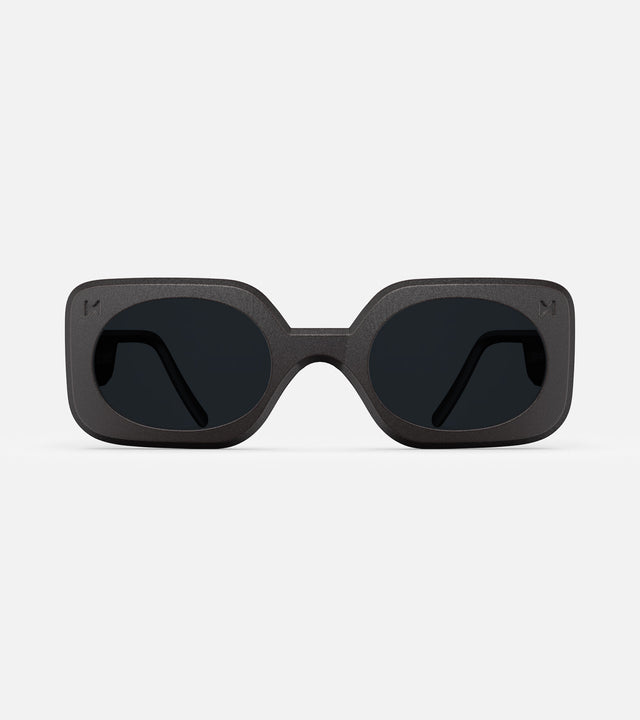 Stylish 3D printed black Planga sunglasses with a bold rectangular frame and dark lenses, designed for a comfortable fit across multiple nose bridges