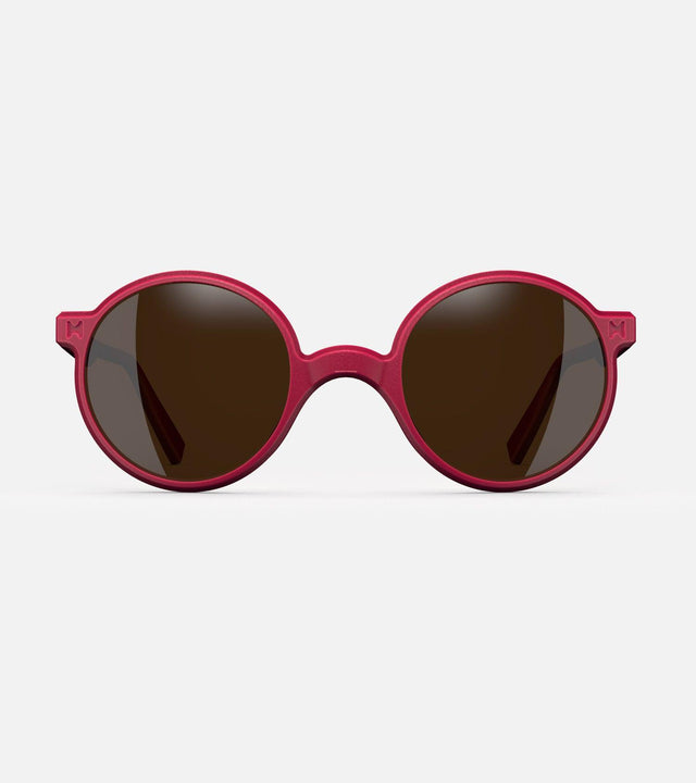 Round red 3D-printed glasses with dark lenses are designed for an excellent fit across various nose profiles. Offering stylish and comfortable option for those seeking unique and customizable eyewear.