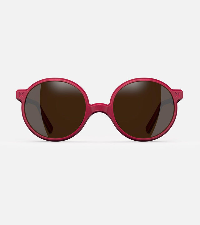 Round red 3D-printed glasses with dark lenses are designed for an excellent fit across various nose profiles. Offering stylish and comfortable option for those seeking unique and customizable eyewear.