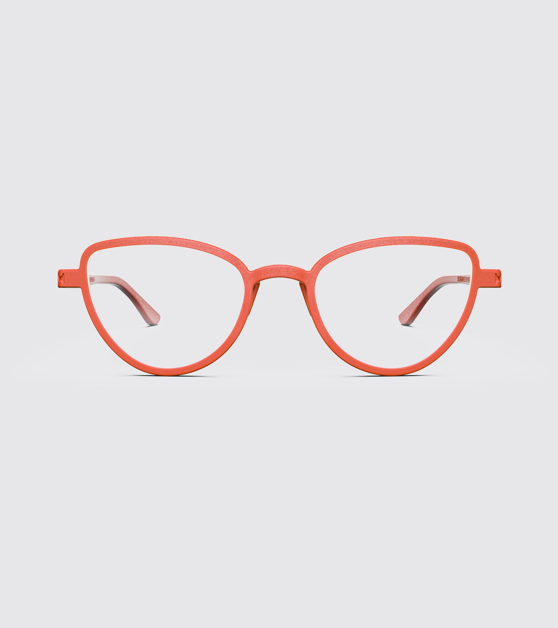 Red eyeglasses on a light gray background