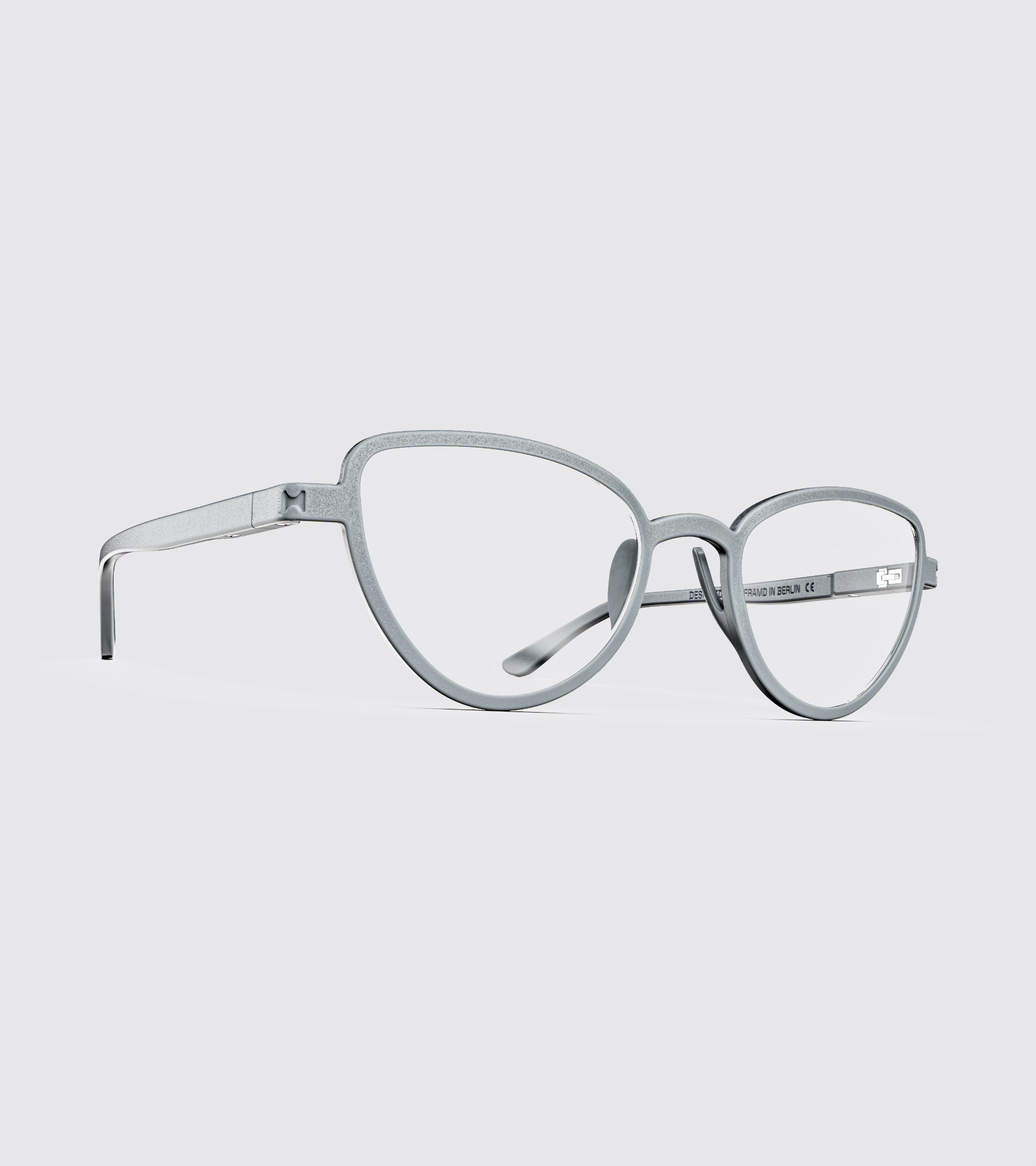 Pair of light gray eyeglasses on a white background