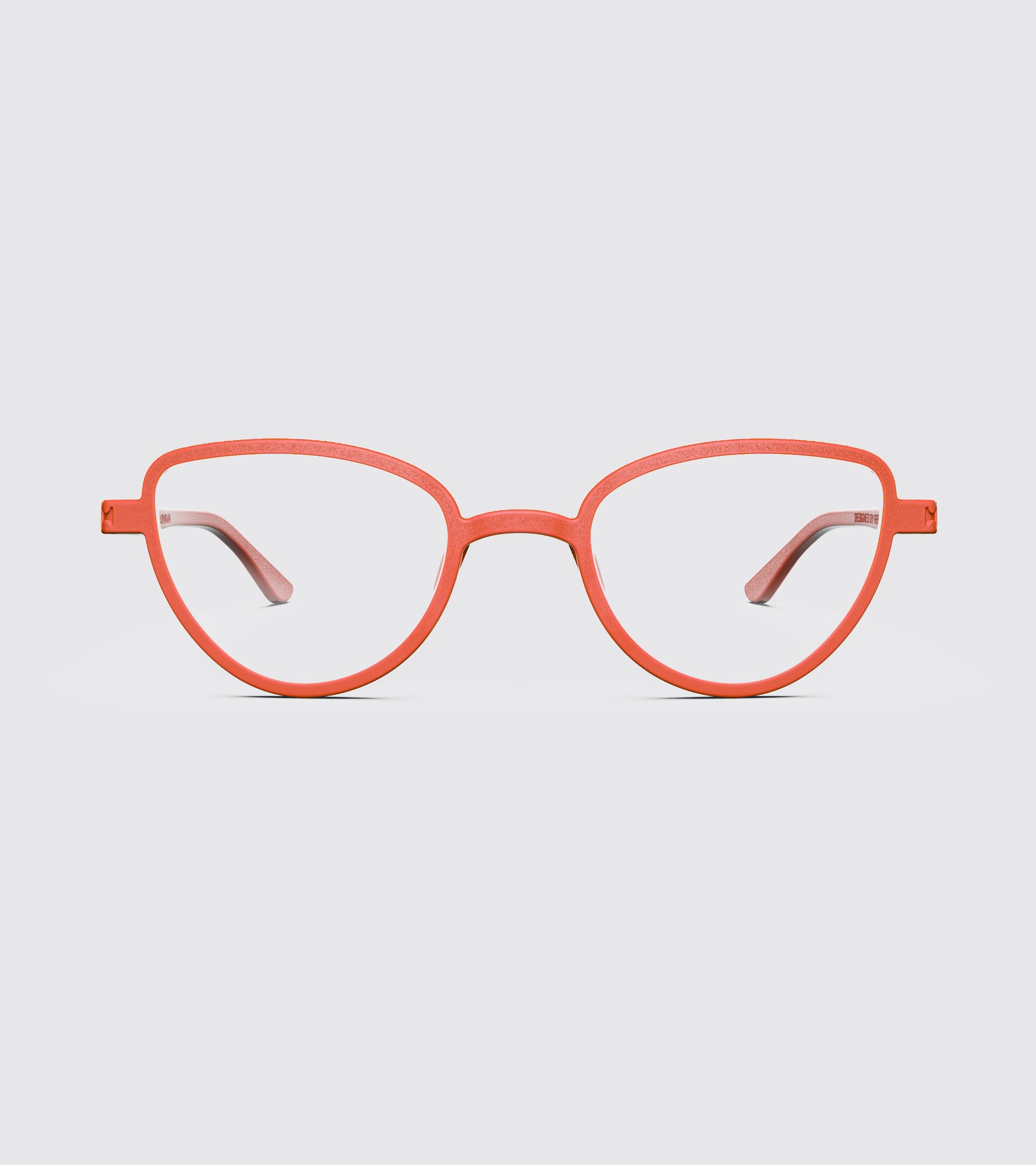 Red eyeglasses on a light gray background