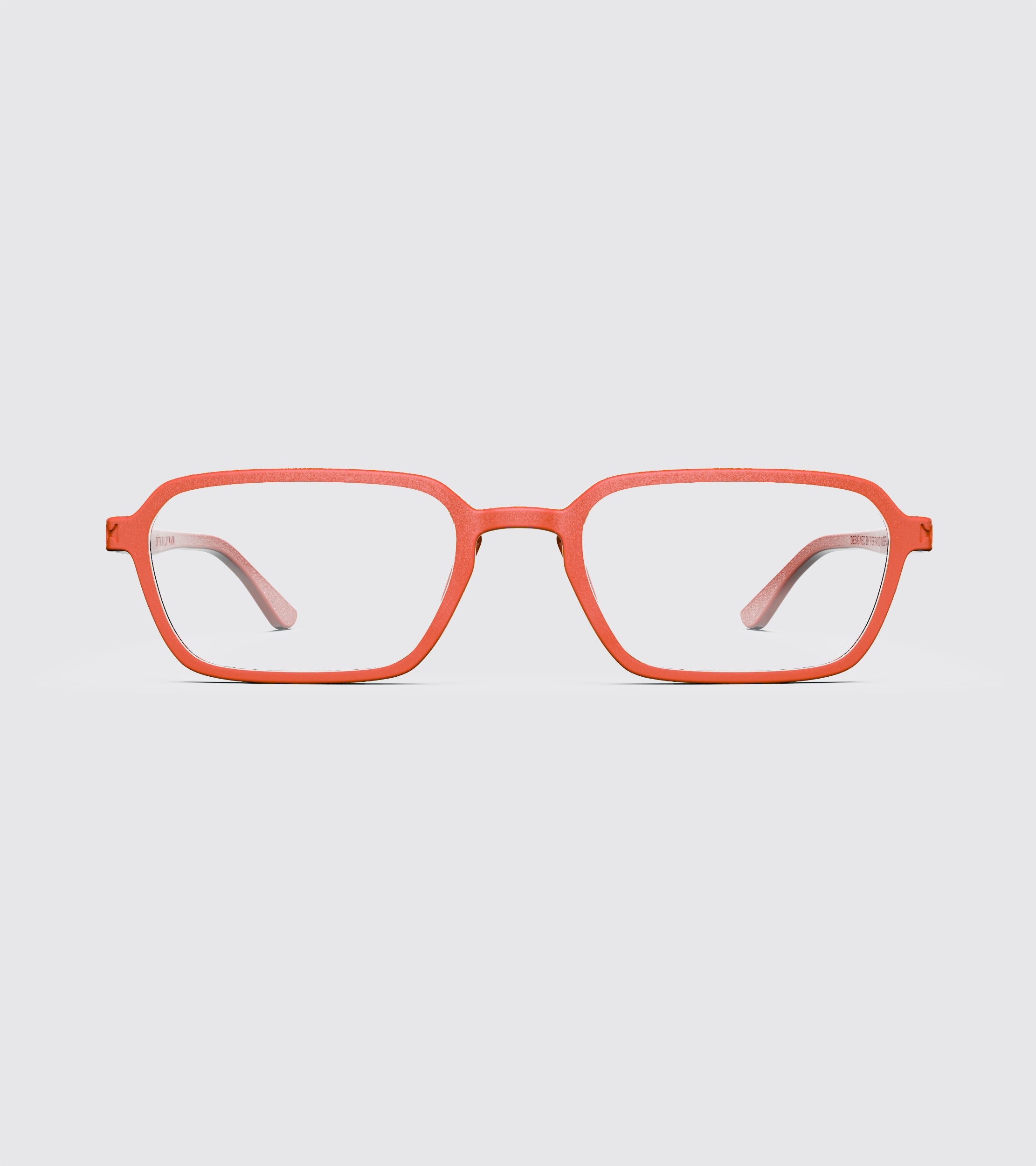 Red eyeglasses on a light gray background