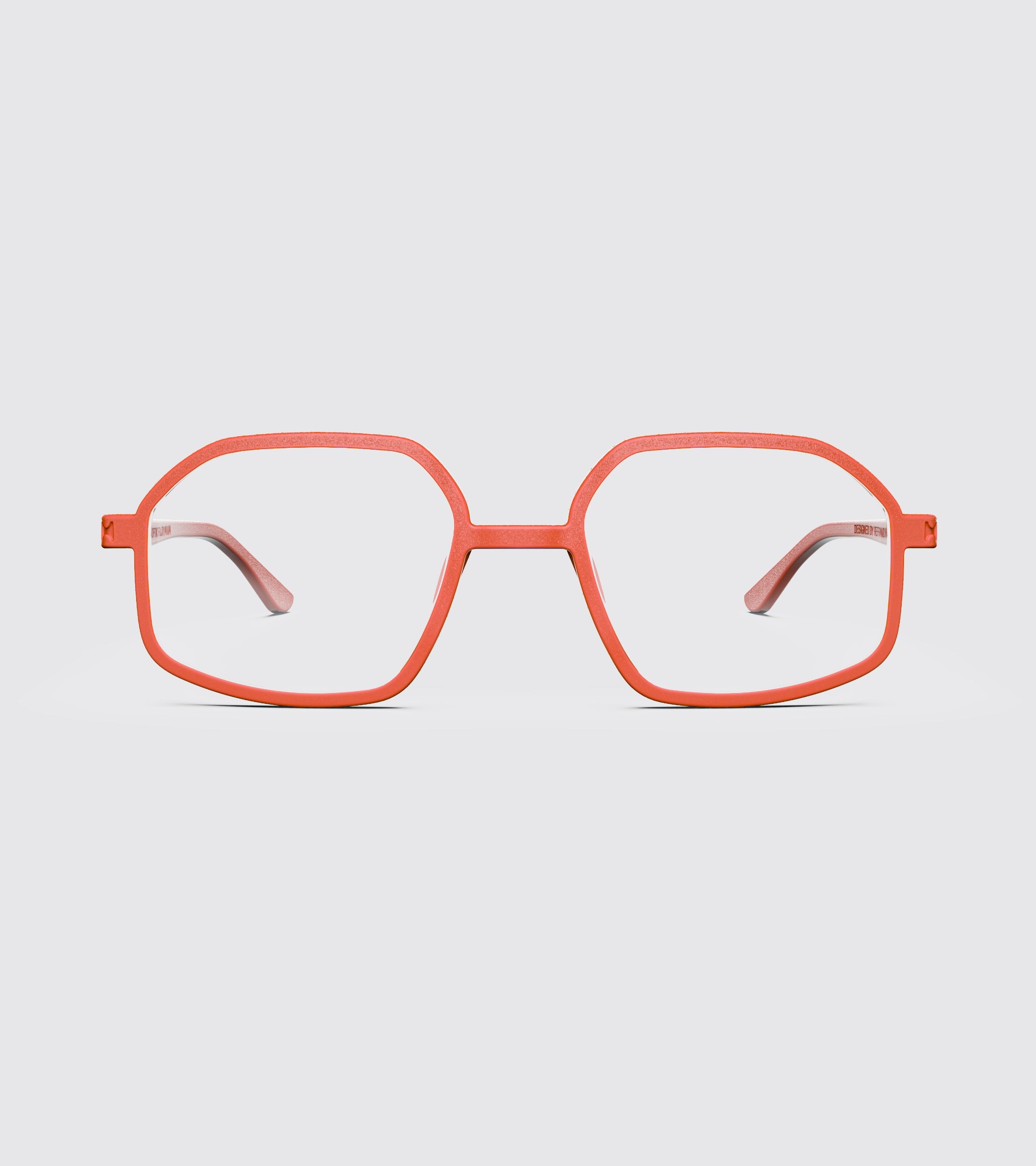 Red eyeglasses on a light gray background