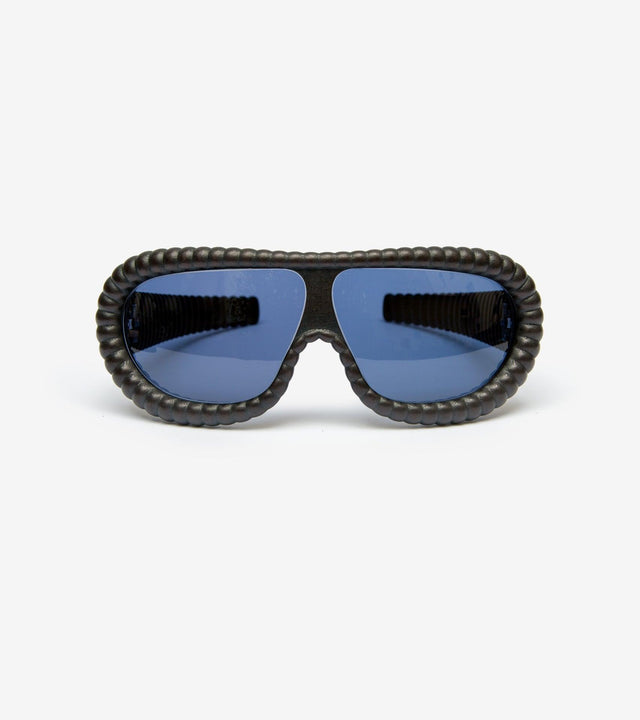 Fashion-forward black sunglasses with textured ribbed frames for a unique statement