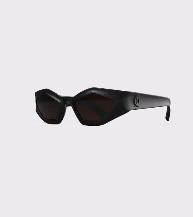 Bold black 3D printed sunglasses with angular frames and dark lenses, offering a unique style and a great fit for various nose bridges
