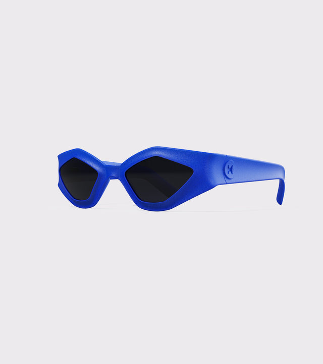 Bold blue 3D printed sunglasses with angular frames and dark lenses, offering a unique style and a great fit for various nose bridges