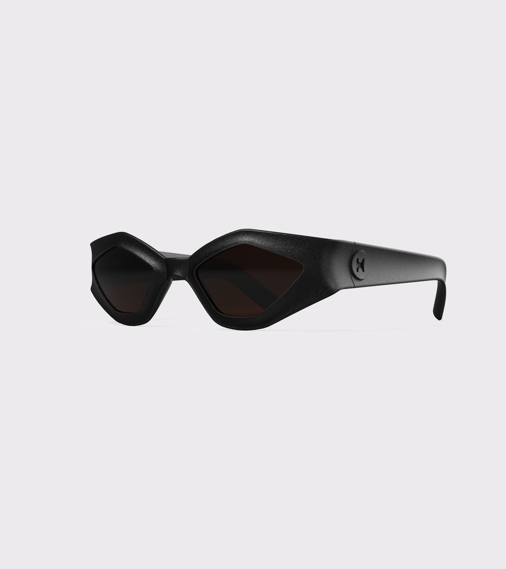 Bold black 3D printed sunglasses with angular frames and dark lenses, offering a unique style and a great fit for various nose bridges