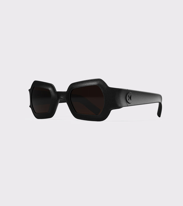 Bold black 3D printed sunglasses with unique geometric frames and dark lenses, designed for an excellent fit across different nose profiles