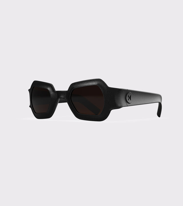 Bold black 3D printed sunglasses with unique geometric frames and dark lenses, designed for an excellent fit across different nose profiles