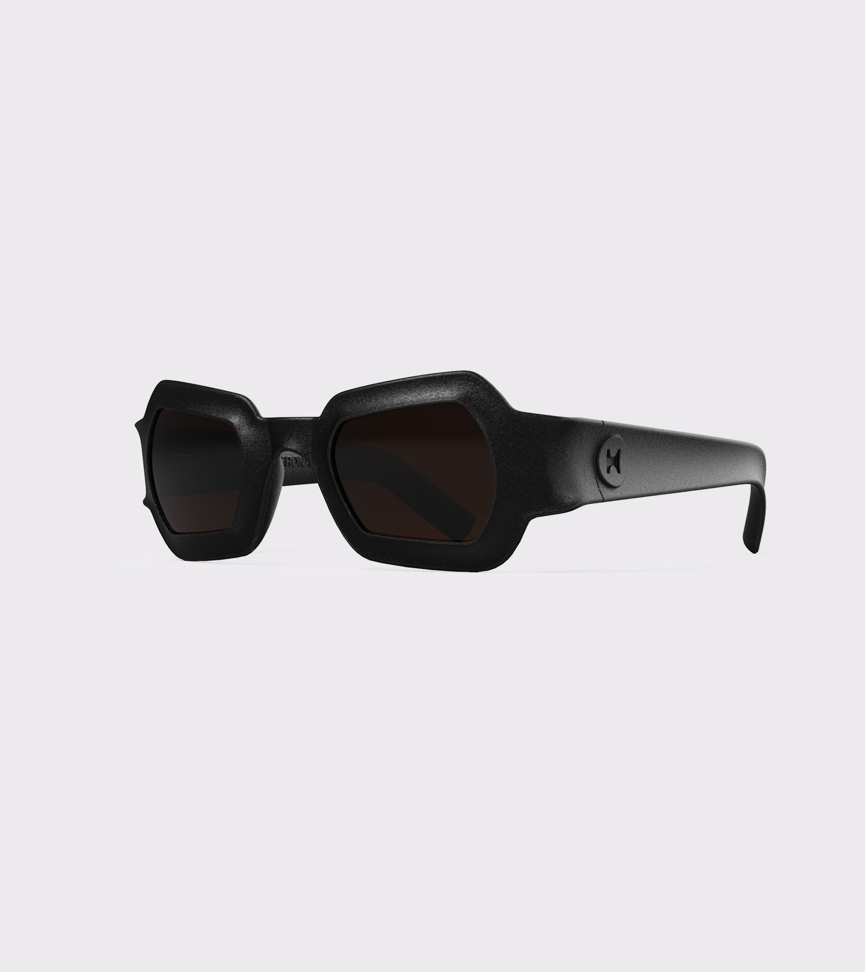 Bold black 3D printed sunglasses with unique geometric frames and dark lenses, designed for an excellent fit across different nose profiles