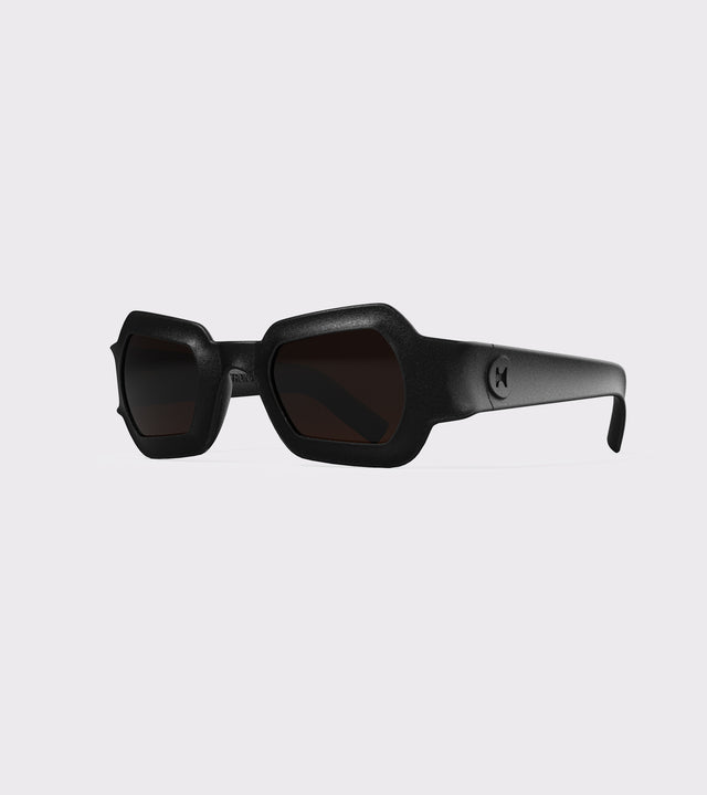 Bold black 3D printed sunglasses with unique geometric frames and dark lenses, designed for an excellent fit across different nose profiles