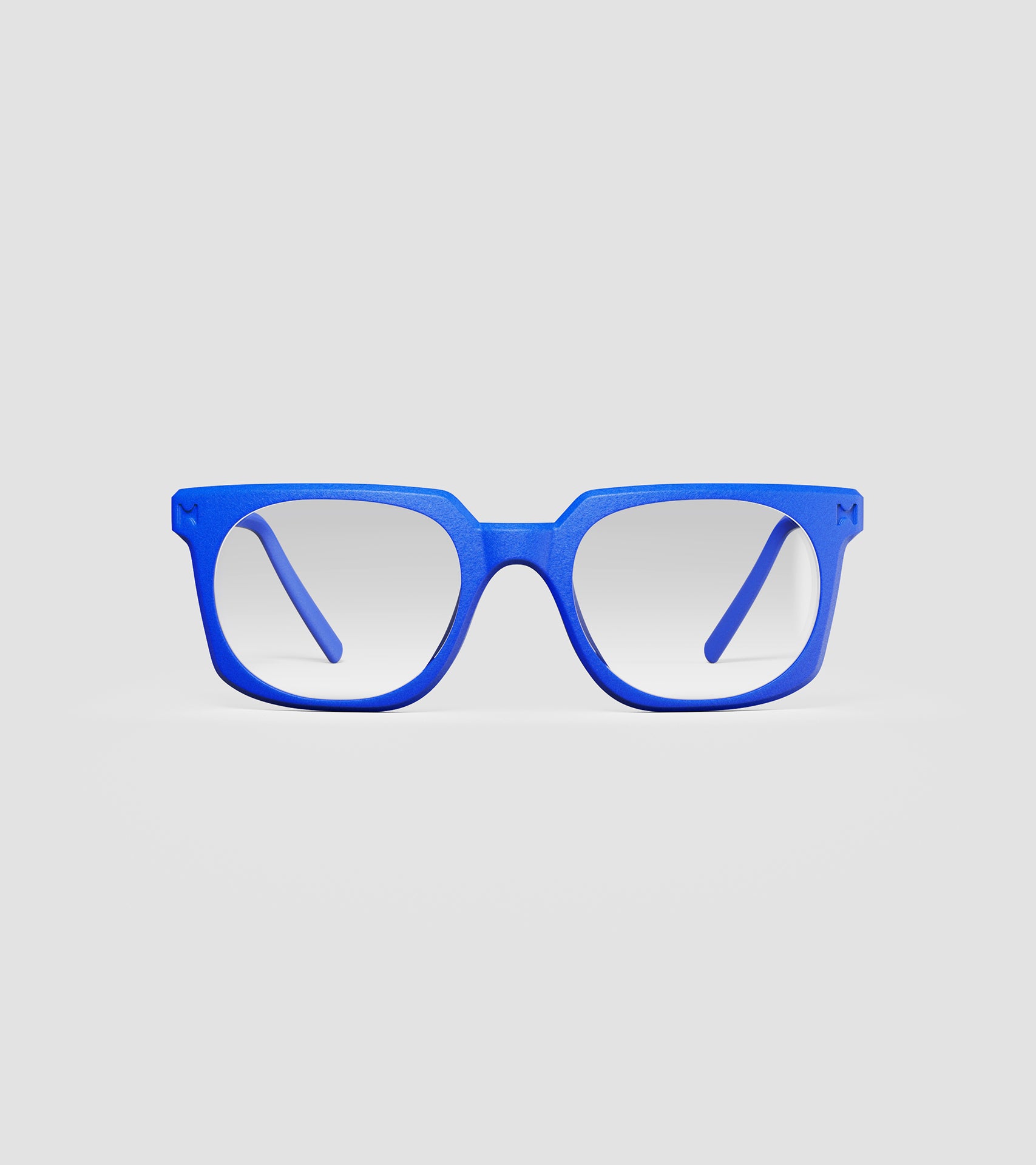 Bold blue square-frame glasses with clear lenses, designed with an inclusive fit for all nose bridges, featuring a modern minimalist design.