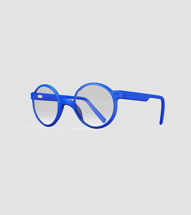 Round blue 3D-printed glasses with clear lenses are designed for an excellent fit across various nose profiles. Offering stylish and comfortable option for those seeking unique and customizable eyewear.