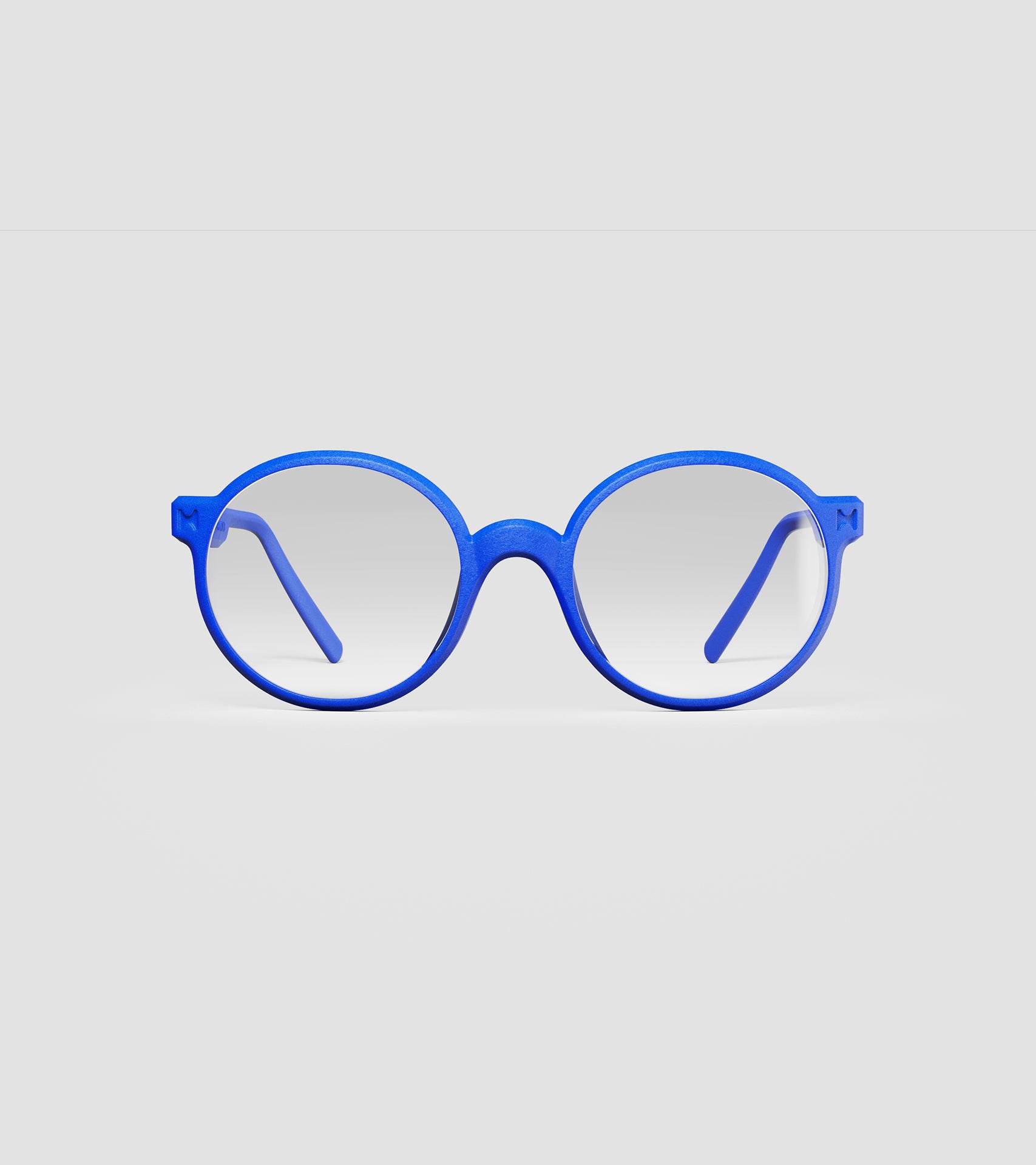 Round blue 3D-printed glasses with clear lenses are designed for an excellent fit across various nose profiles. Offering stylish and comfortable option for those seeking unique and customizable eyewear.
