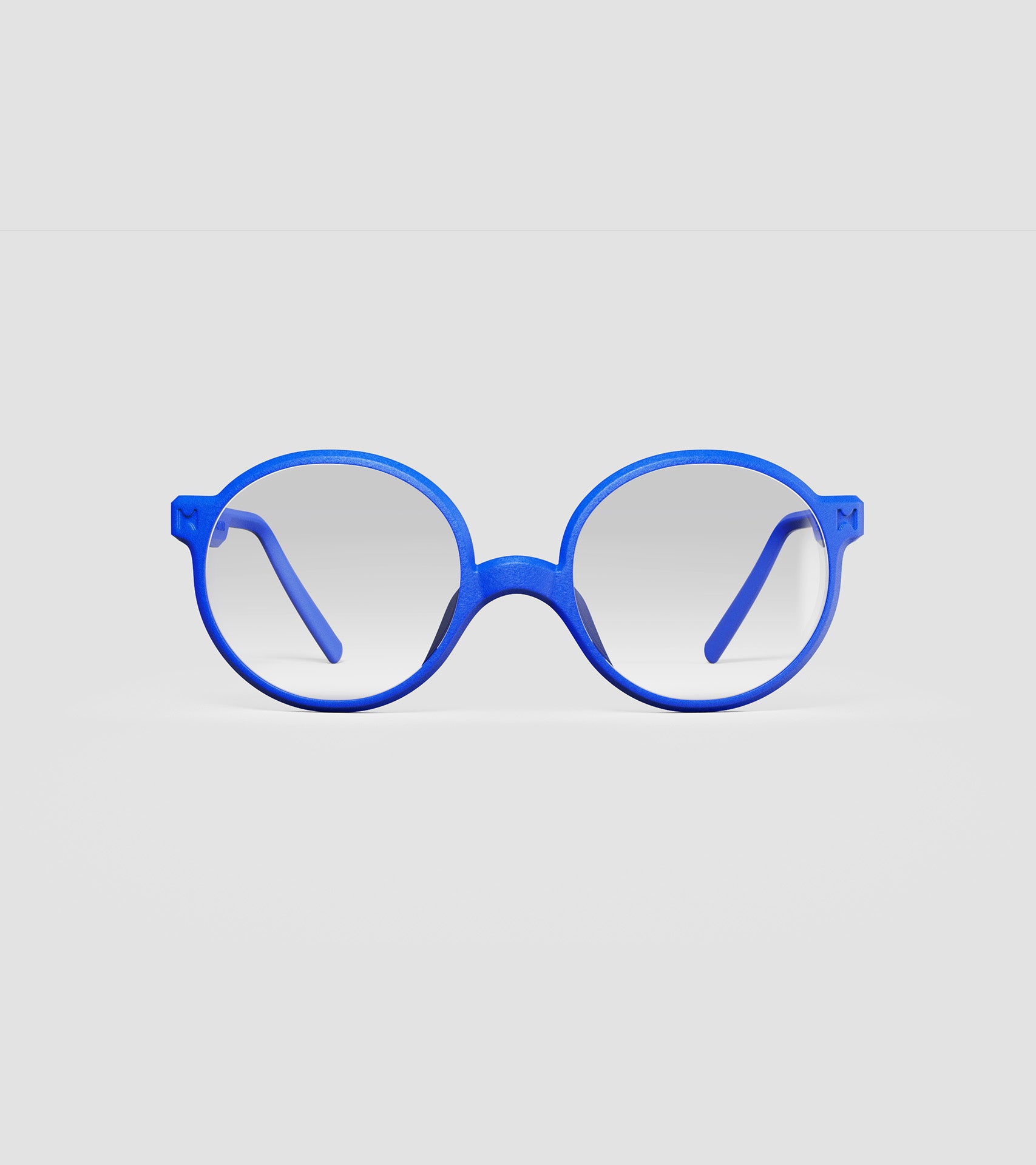 Round blue 3D-printed glasses with clear lenses are designed for an excellent fit across various nose profiles. Offering stylish and comfortable option for those seeking unique and customizable eyewear.