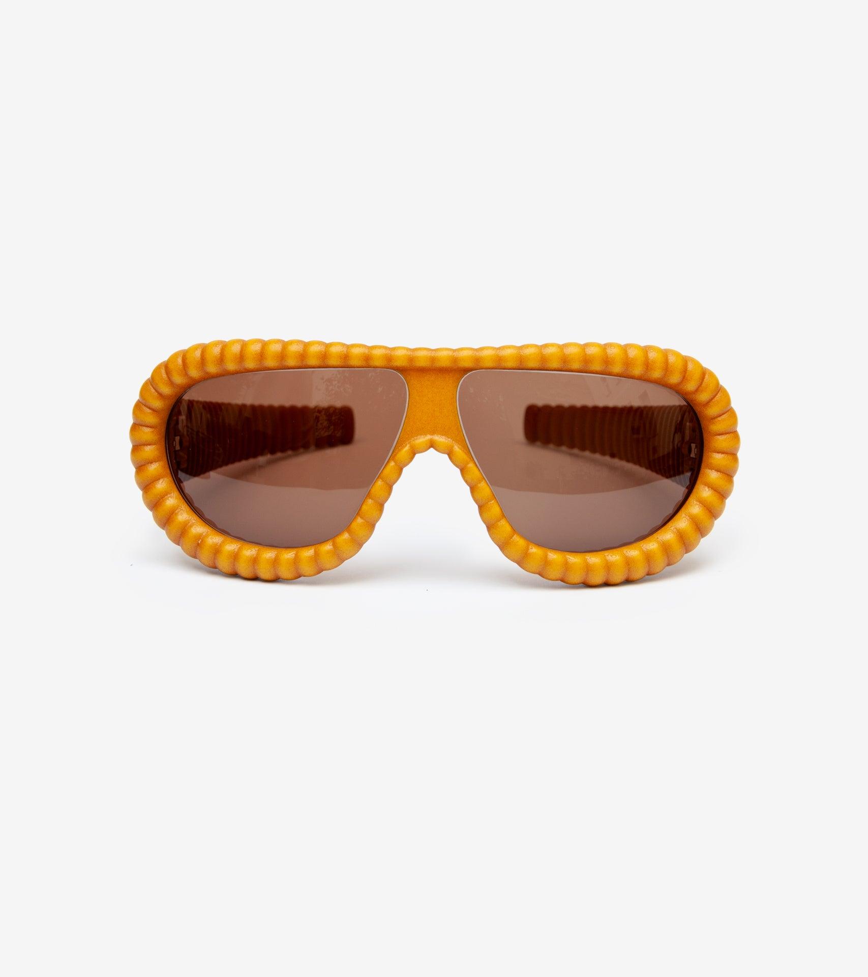Luxurious gold ribbed sunglasses with brown lenses, designed for a high-end look