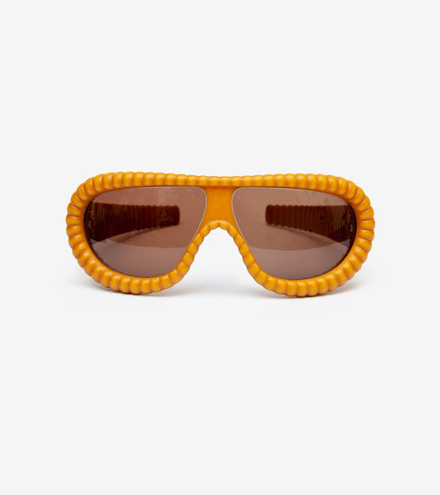 Luxurious gold ribbed sunglasses with brown lenses, designed for a high-end look