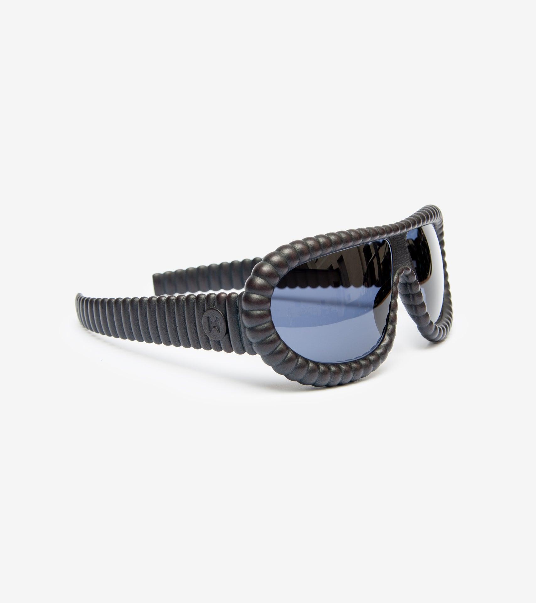 High-fashion black 3D-printed sunglasses with distinctive ribbed design
