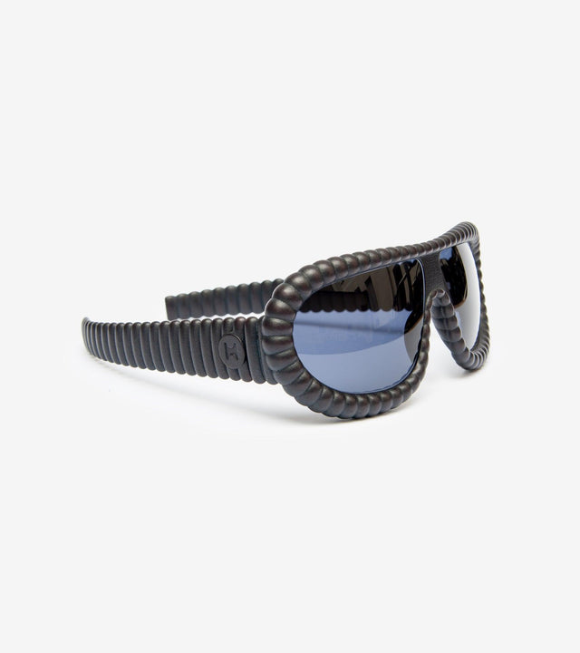 High-fashion black 3D-printed sunglasses with distinctive ribbed design
