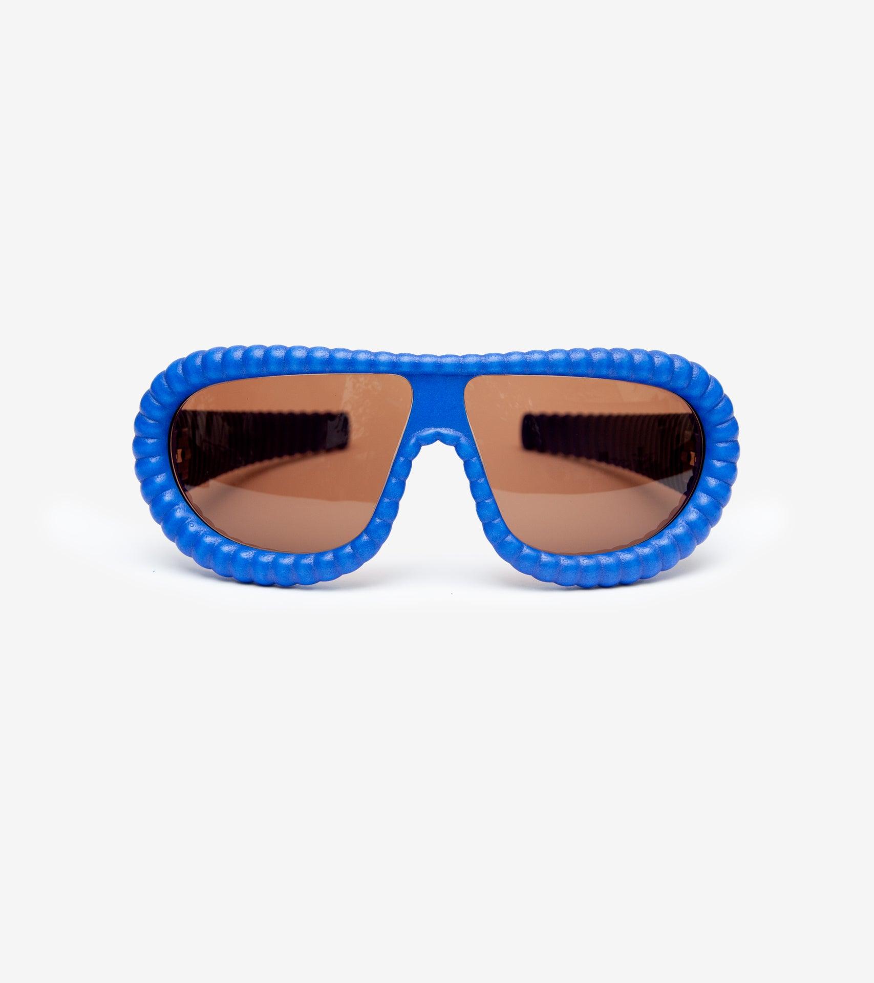 Fashion-forward blue 3D-printed sunglasses with unique ribbed frames