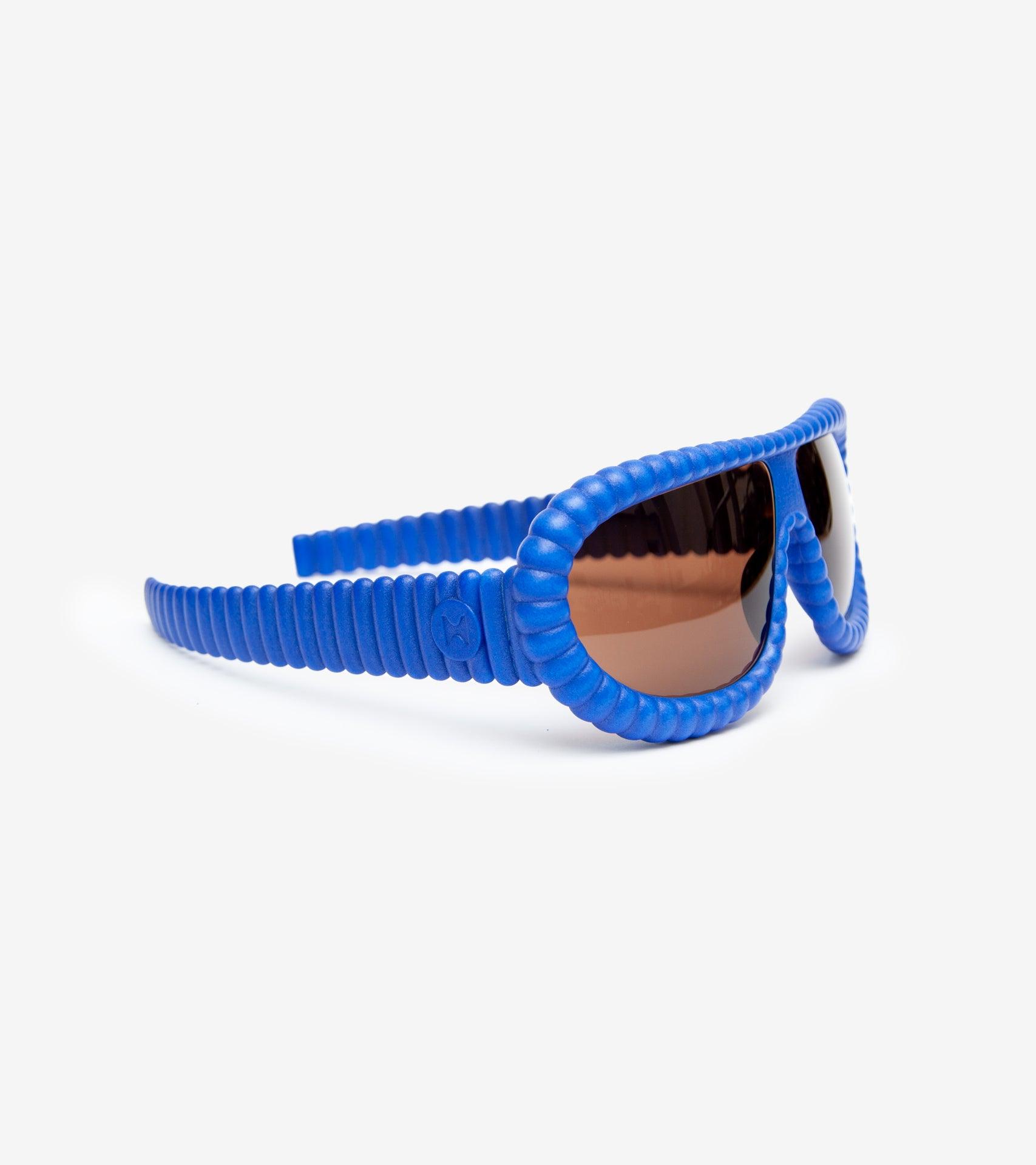 Fashion-forward blue 3D-printed sunglasses with unique ribbed frames