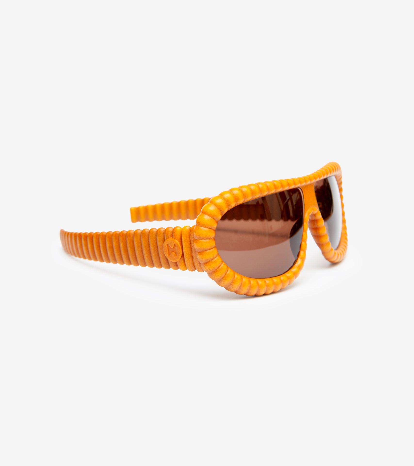 Elegant gold 3D-printed sunglasses featuring unique ribbed frames for luxury style for large noses