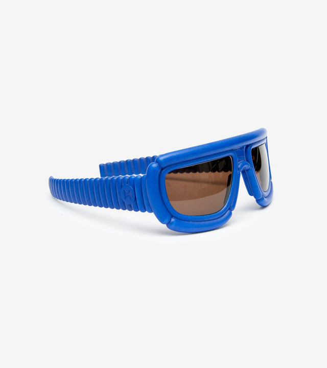 Distinctive 3D-printed sunglasses with blue padded frames, perfect for avant-garde fashion