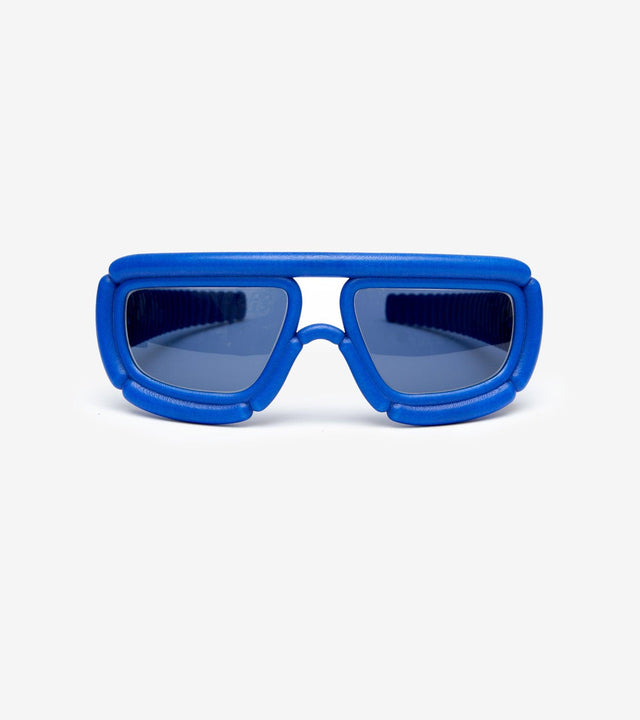 Bold blue sunglasses with padded frames, designed for a unique and contemporary aesthetic