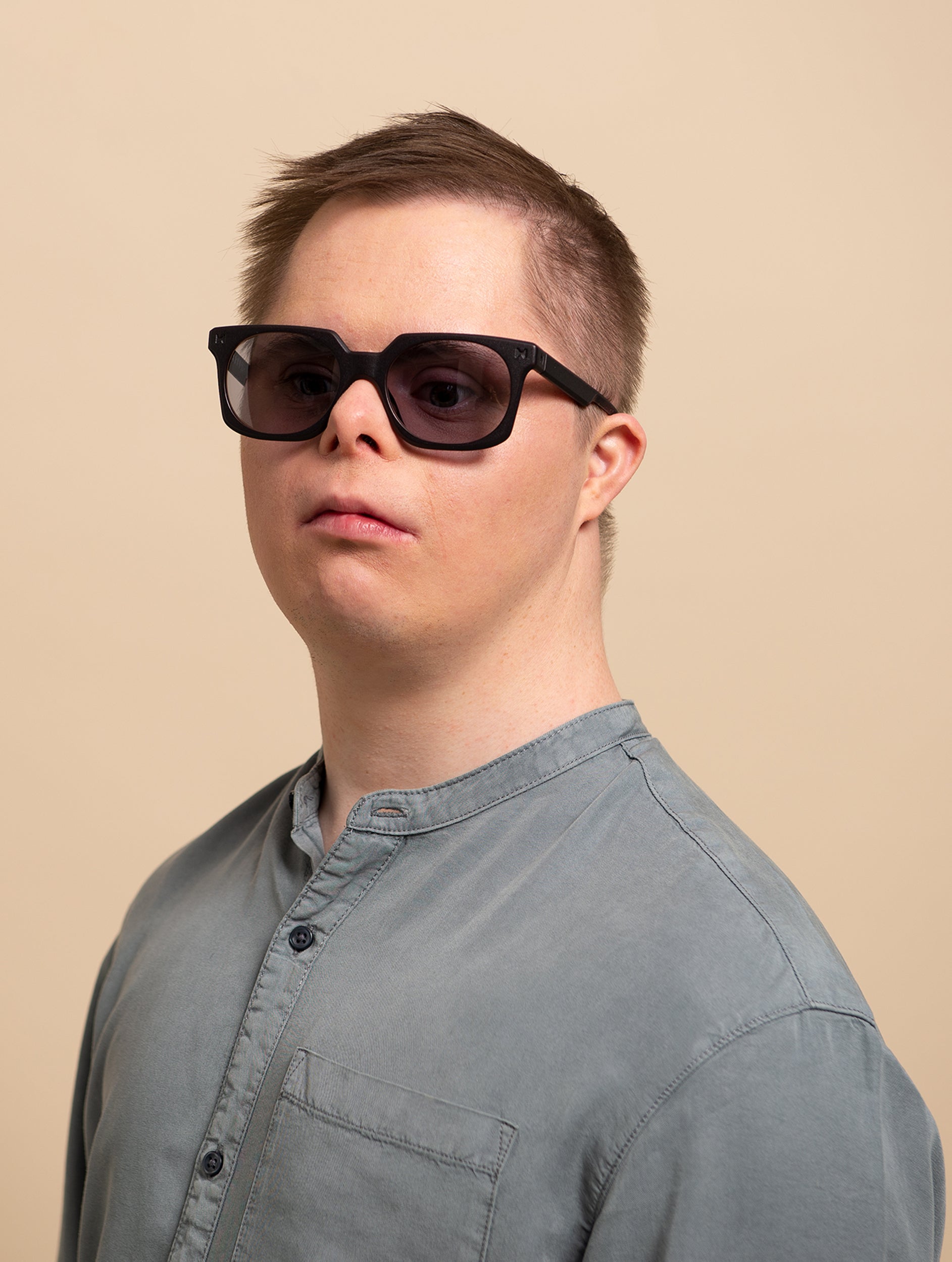 Man wearing black square sunglasses