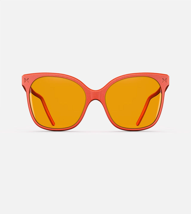 Bright orange Missy eyewear for a playful, modern style.