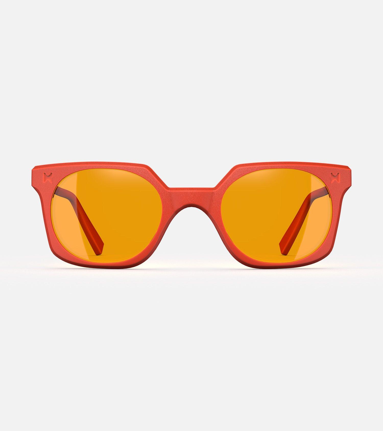 Orange square-frame glasses with yellow lenses, designed with an inclusive fit for all nose bridges, featuring a modern minimalist design