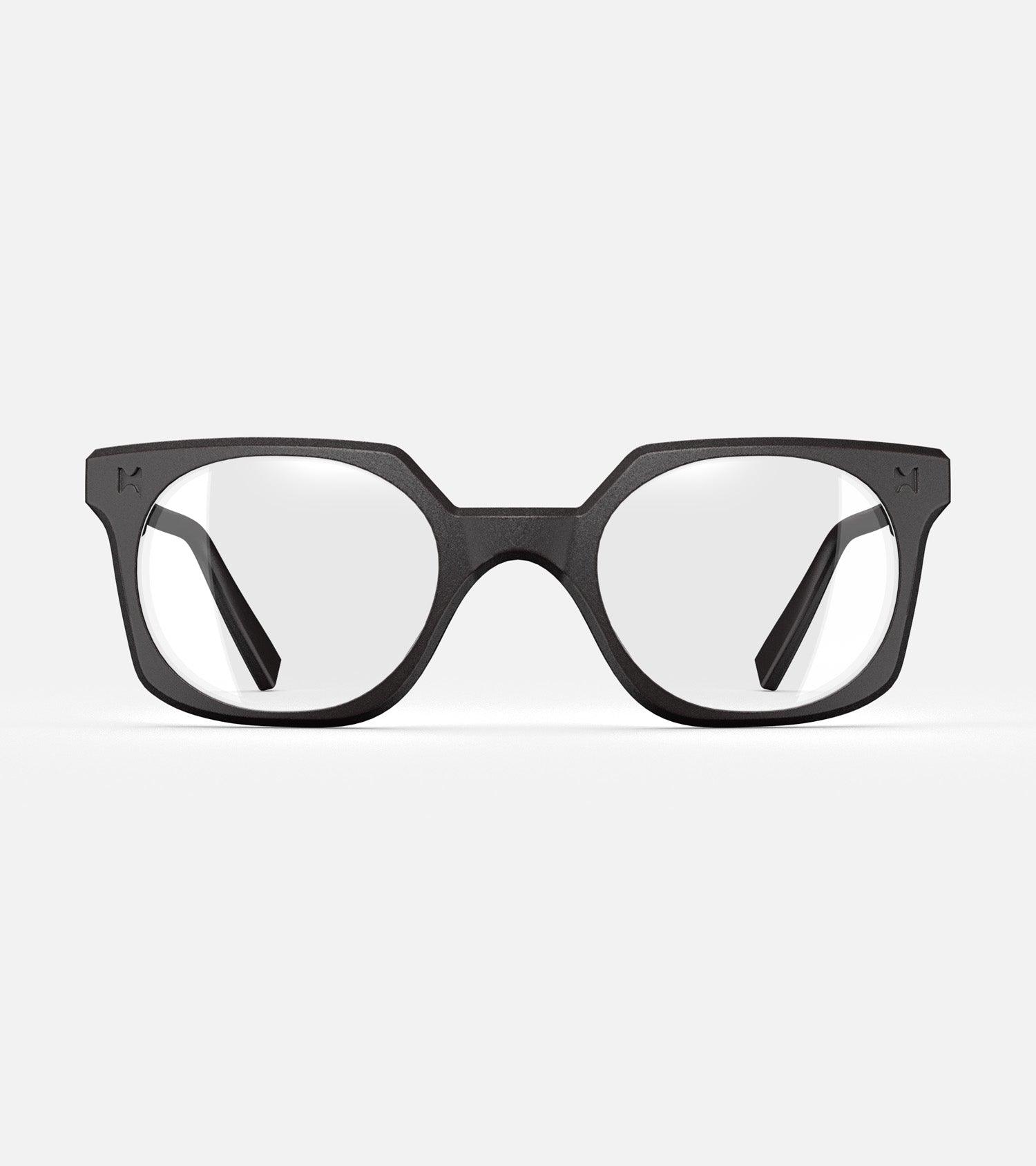 Black square-frame glasses with clear lenses, designed with an inclusive fit for all nose bridges, featuring a modern minimalist design