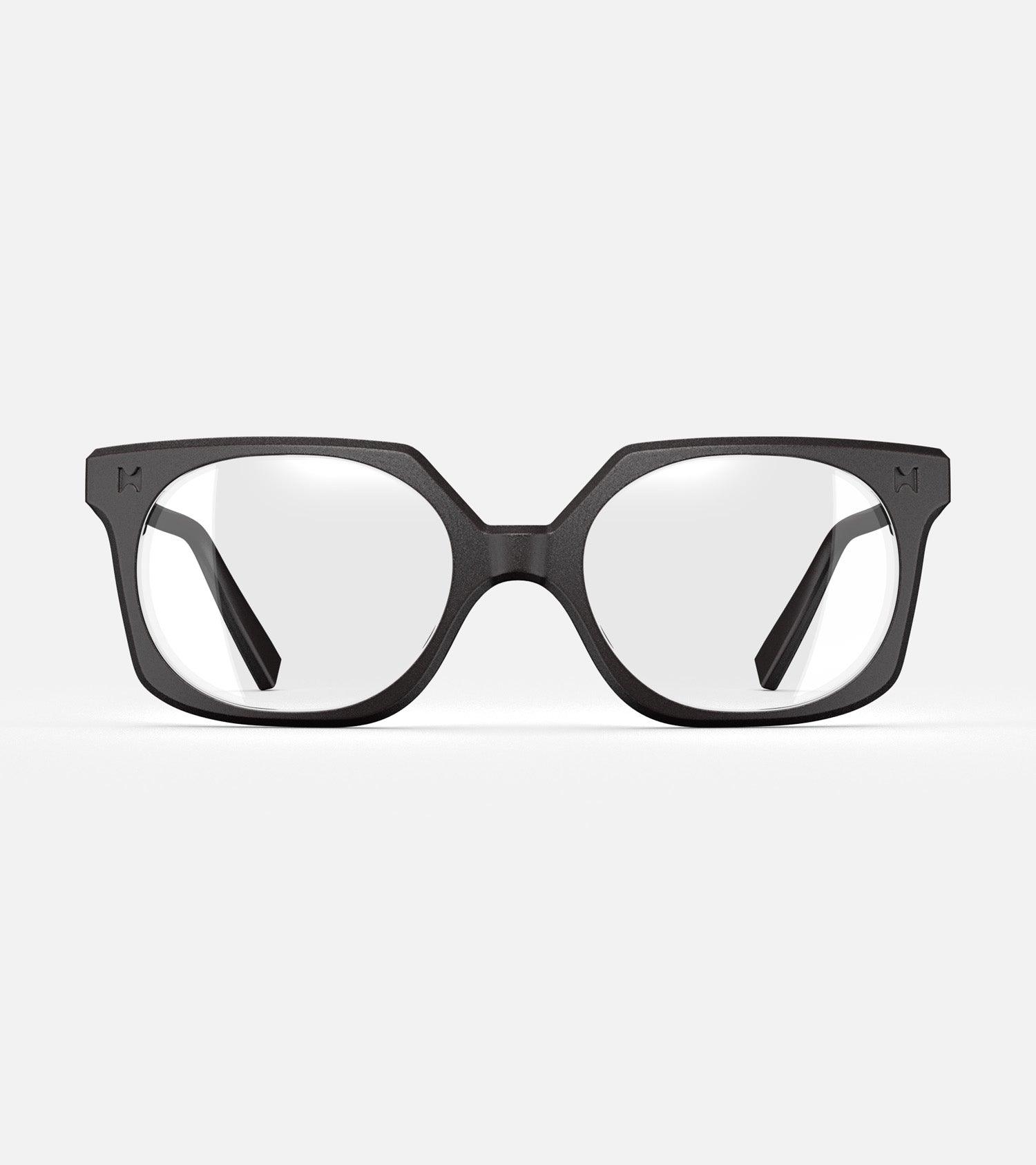 Black square-frame glasses with clear lenses, designed with an inclusive fit for all nose bridges, featuring a modern minimalist design