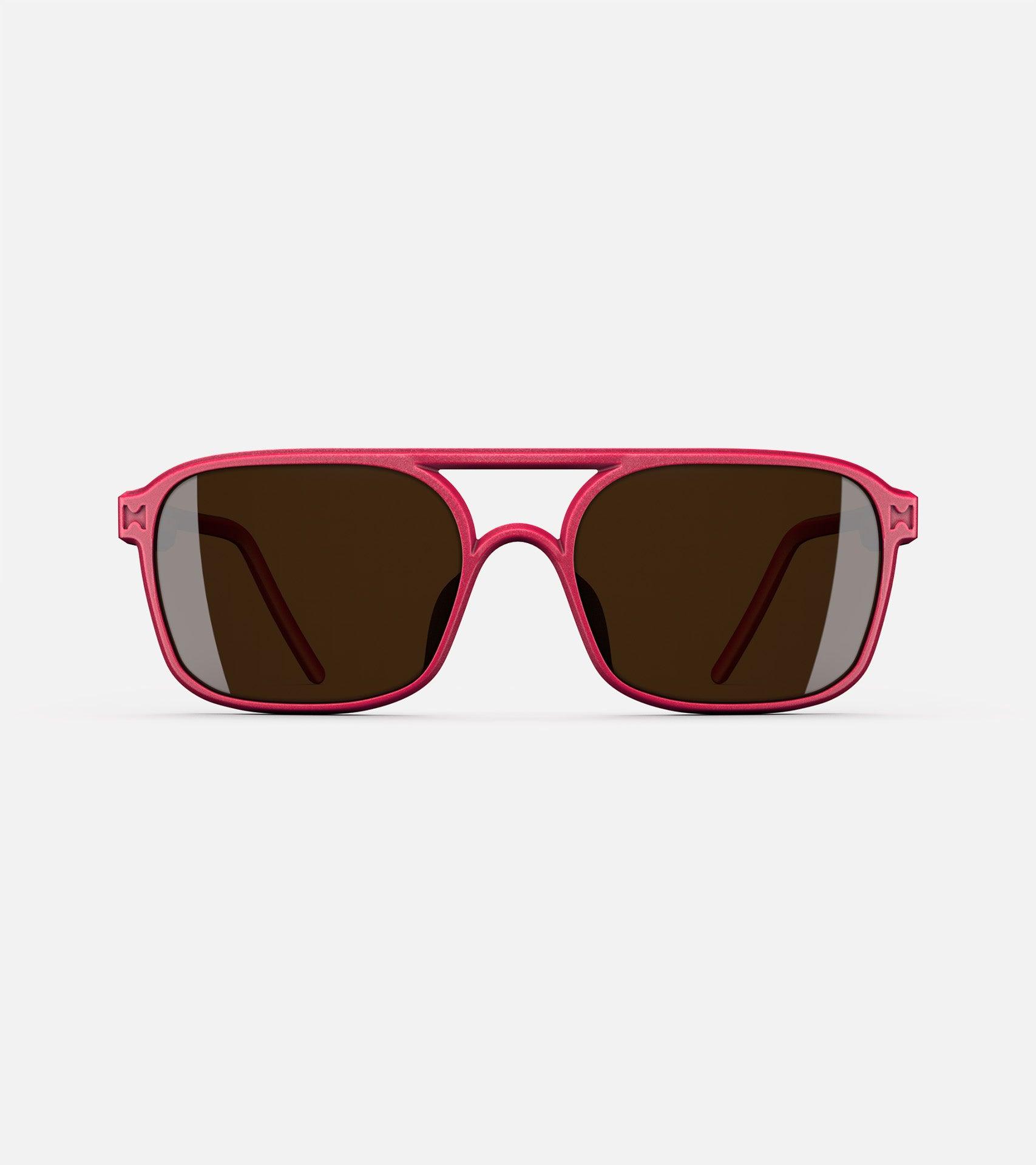 Red aviator glasses with a double bridge design, featuring dark lenses and sleek side arms for a bold, modern look.