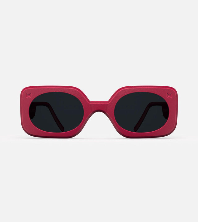 Vibrant red Planga sunglasses by Reframd for low nose bridges, with bold, square frames and grey lenses, ideal for sunny days.