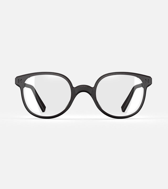Modern black framed glasses for wide nose bridges with round brown lenses on a white background