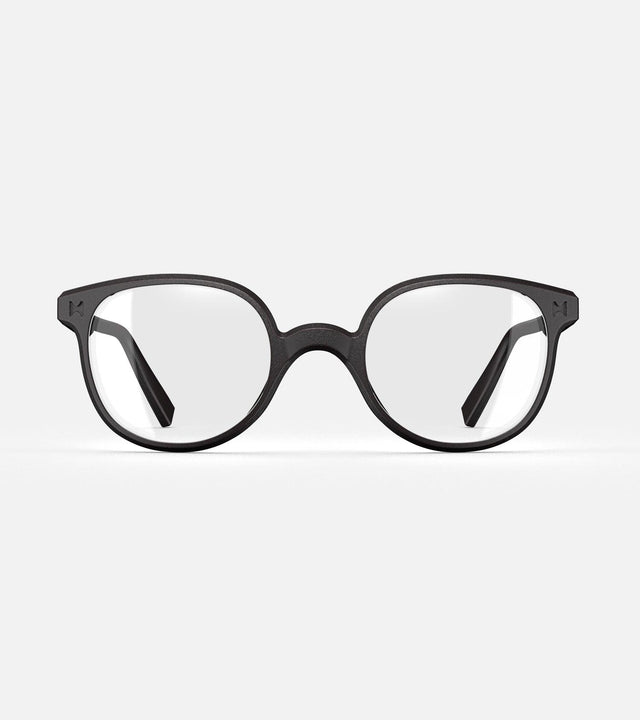 Black 3D printed glasses with clear lenses, featuring a versatile and comfortable fit for various nose profiles, perfect for those seeking modern, stylish eyewear with customization options