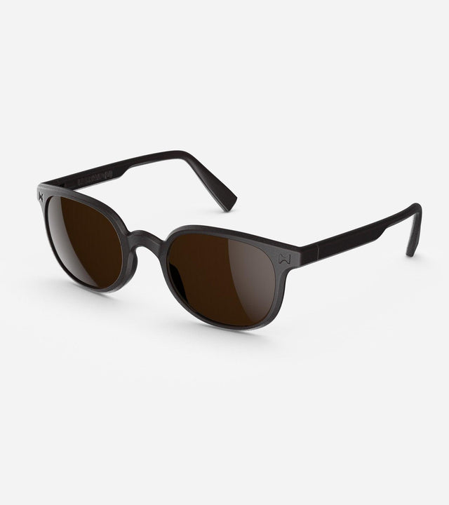 Modern black sunglasses for narrow nose bridges with round brown lenses on a white background