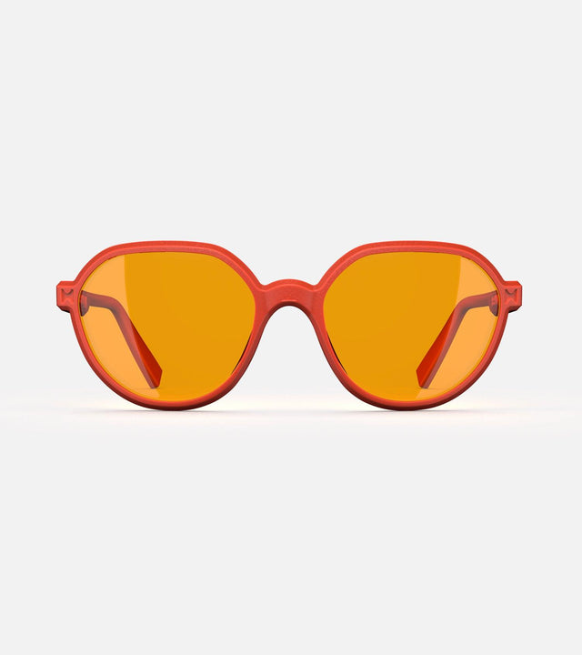 3D printed orange round sunglasses with yellow lenses, offering a stylish and sustainable choice for low nose bridges