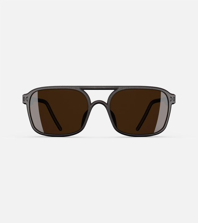 Narrow bridge, black rectangular framed sunglasses with brown lenses by reframd, featuring a modern design. Front view.