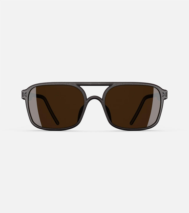 Black aviator glasses with a double bridge design, featuring dark lenses and sleek side arms for a bold, modern look.