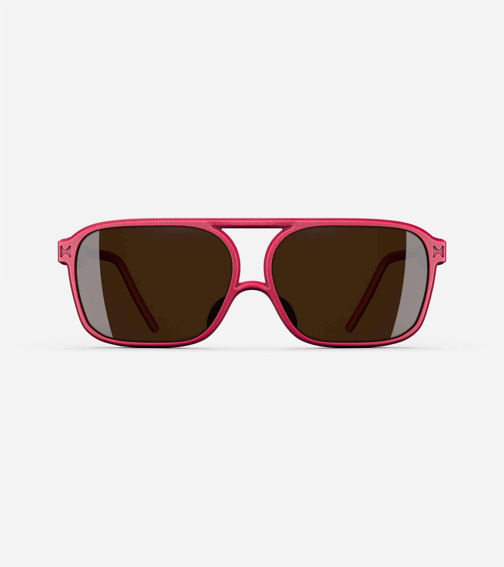 Red aviator glasses with a double bridge design, featuring dark lenses and sleek side arms for a bold, modern look.